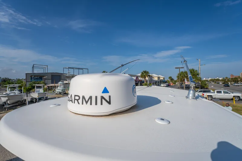 Slide: The Image of 2019 Sea Pro 239 DLX boat with Garmin radar, clear blue sky background. - 25