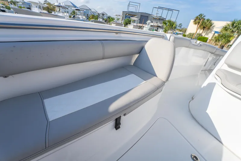 Slide: The Image of 2019 Sea Pro 239 DLX boat interior with gray seating and sleek design. - 26