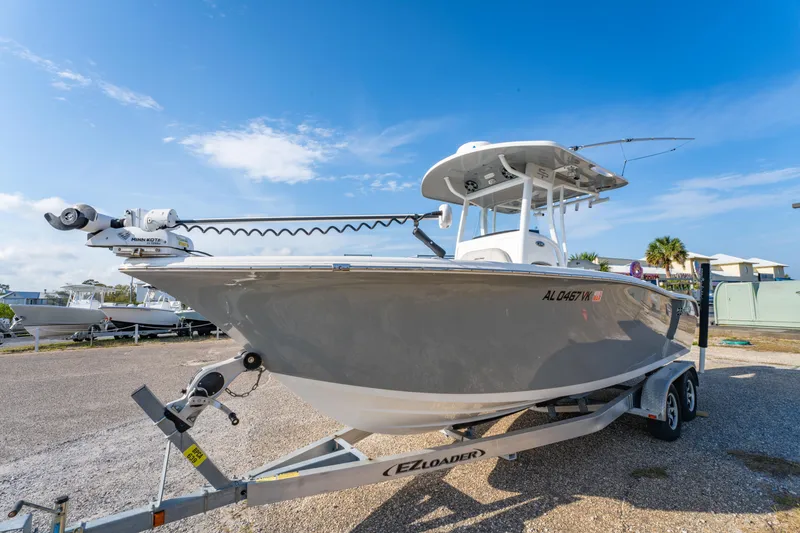 Slide: The Image of 2019 Sea Pro 239 DLX boat on trailer under clear blue sky. - 7
