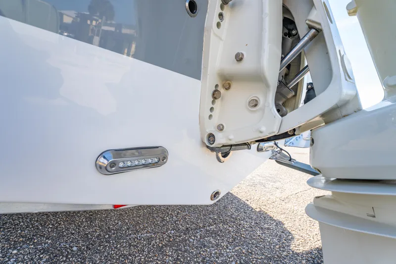 Slide: The Image of 2019 Sea Pro 239 DLX boat detail showing hull and motor components. - 9