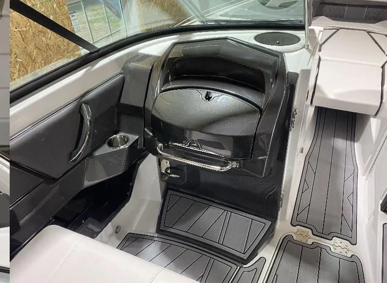 Slide: The Image of 2023 Monterey 298 Super Sport interior with sleek black and white design, featuring modern controls. - 11