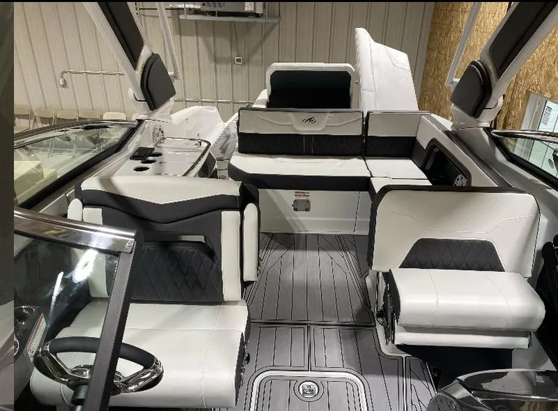 Slide: The Image of 2023 Monterey 298 Super Sport boat interior with luxurious seating and modern design. - 13