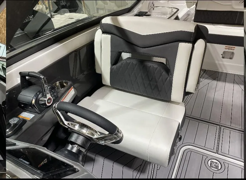 Slide: The Image of 2023 Monterey 298 Super Sport cockpit with sleek steering and modern seating design. - 14
