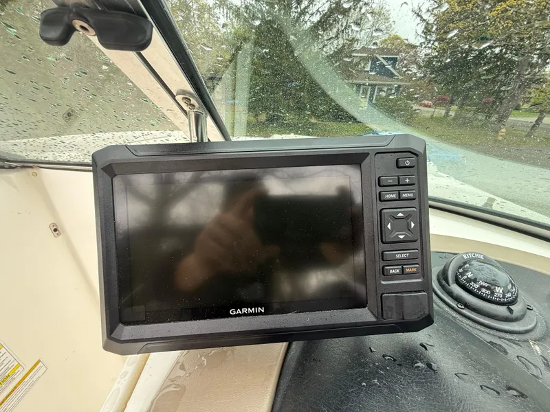 Slide: The Image of Garmin GPS device on 2012 Sea Ray 280 Sundeck boat dashboard, rainy day. - 10
