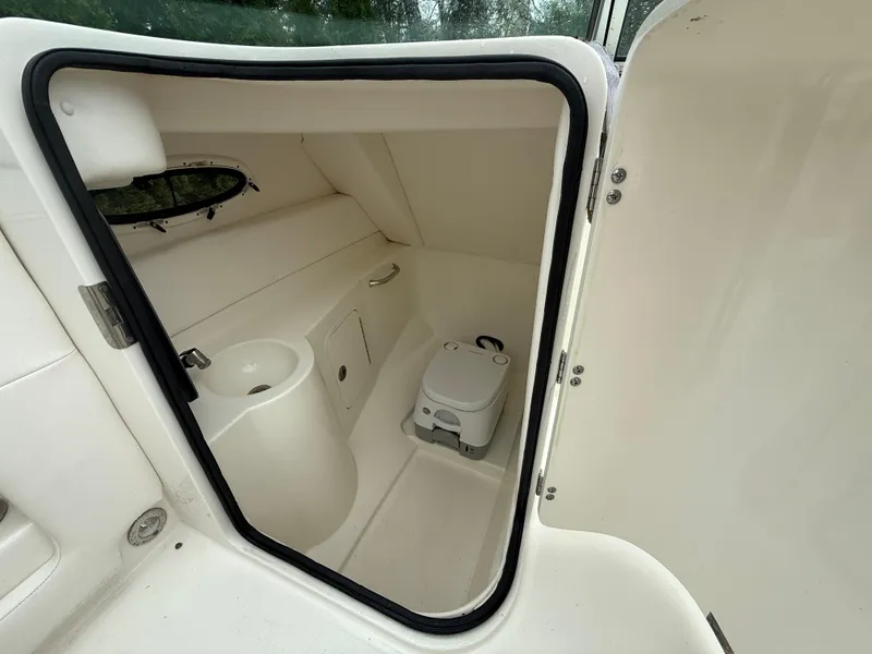 Slide: The Image of Interior view of 2012 Sea Ray 280 Sundeck boat bathroom with compact toilet. - 17