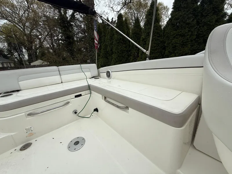 Slide: The Image of 2012 Sea Ray 280 Sundeck interior with white seating and outdoor setting. - 20