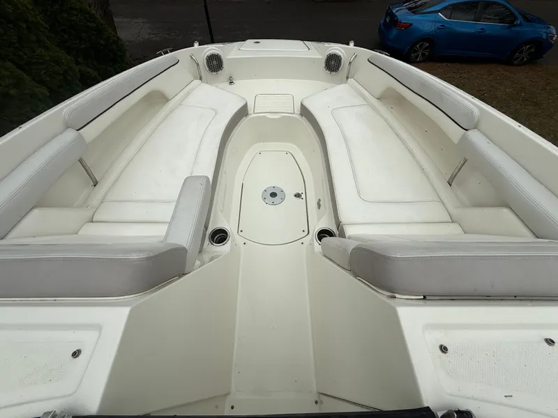 Slide: The Image of 2012 Sea Ray 280 Sundeck boat with spacious white seating area. - 3