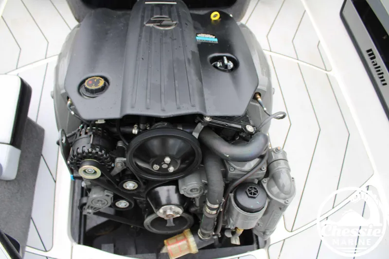 Slide: The Image of 2024 Malibu TXi Mo boat engine, detailed view of components and layout. - 11