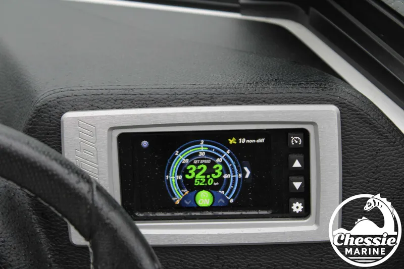 Slide: The Image of 2024 Malibu TXi Mo dashboard display showing speed and settings. - 19