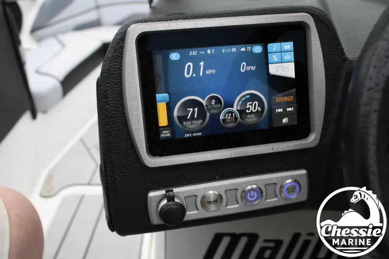 Slide: The Image of 2024 Malibu TXi Mo dashboard with digital display and control buttons. - 21