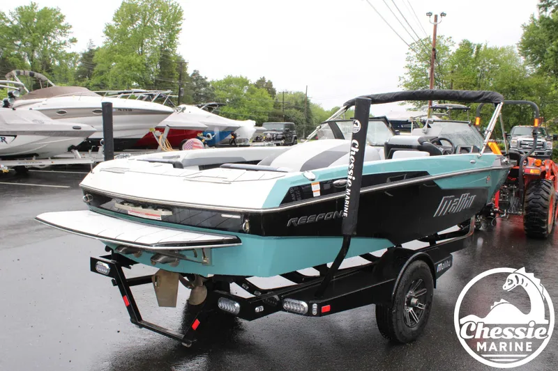 Slide: The Image of 2024 Malibu TXi Mo boat on trailer at Chessie Marine dealership. - 3