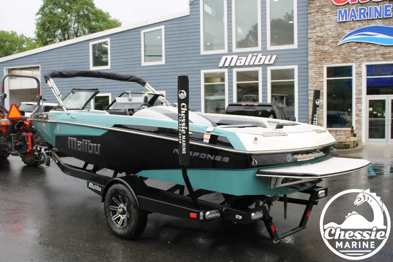 Slide: The Image of 2024 Malibu TXi Mo boat on trailer at Chessie Marine dealership. - 5