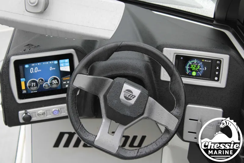 Slide: The Image of 2024 Malibu TXi Mo dashboard with steering wheel and digital displays, featuring Chessie Marine logo. - 7