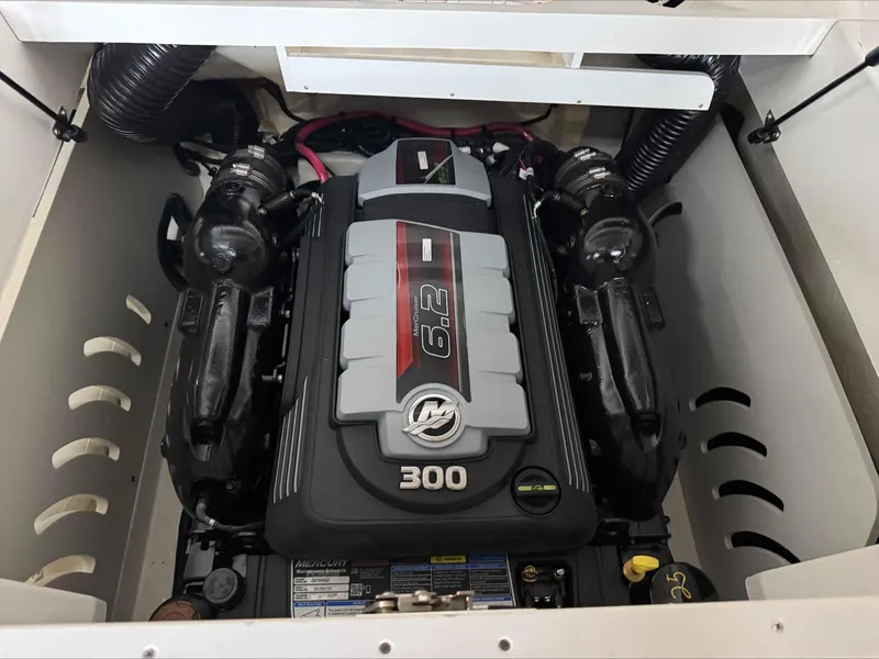Slide: The Image of Engine compartment of 2024 Sea Ray 230SPX boat, featuring a powerful 6.2L engine. - 12