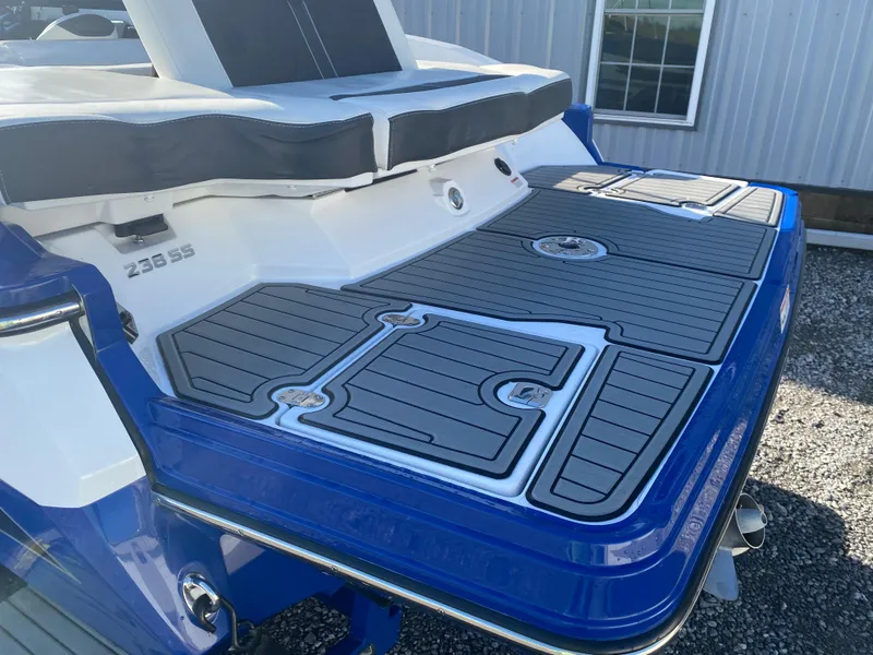 Slide: The Image of 2020 Monterey 238 Super Sport boat with blue and gray swim platform. - 12