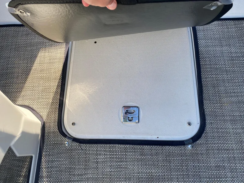 Slide: The Image of 2020 Monterey 238 Super Sport boat storage compartment with textured flooring. - 14