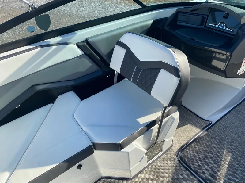 Slide: The Image of 2020 Monterey 238 Super Sport boat interior with sleek seating and modern dashboard design. - 19