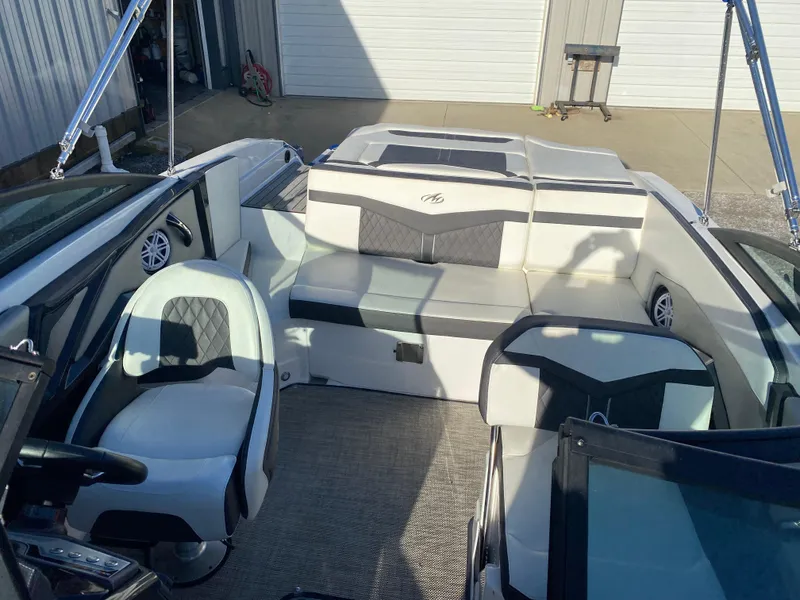 Slide: The Image of 2020 Monterey 238 Super Sport boat interior with white and black seating. - 21