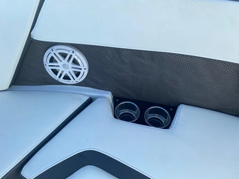 Slide: The Image of 2020 Monterey 238 Super Sport boat interior with speaker and cup holders. - 25