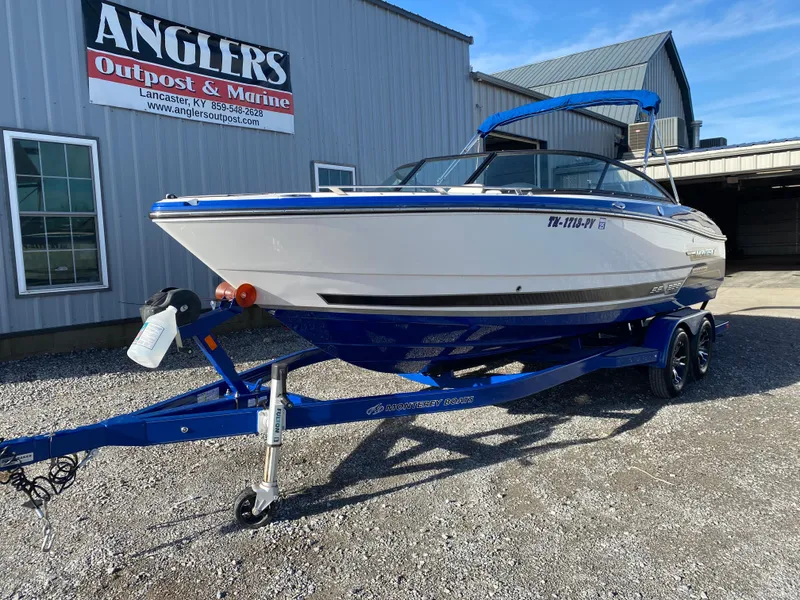Slide: The Image of 2020 Monterey 238 Super Sport boat on blue trailer at Anglers Outpost & Marine. - 3