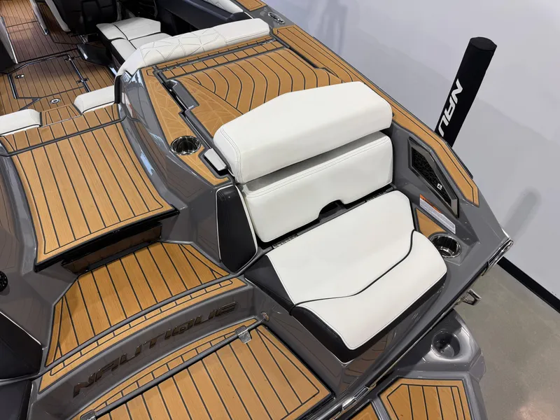 Slide: The Image of 2023 Nautique Super Air Nautique G23 Paragon interior with teak flooring and white seating. - 11