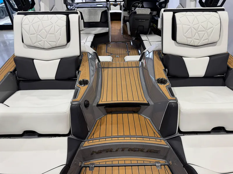 Slide: The Image of 2023 Nautique Super Air Nautique G23 Paragon interior with luxurious seating and teak flooring. - 13