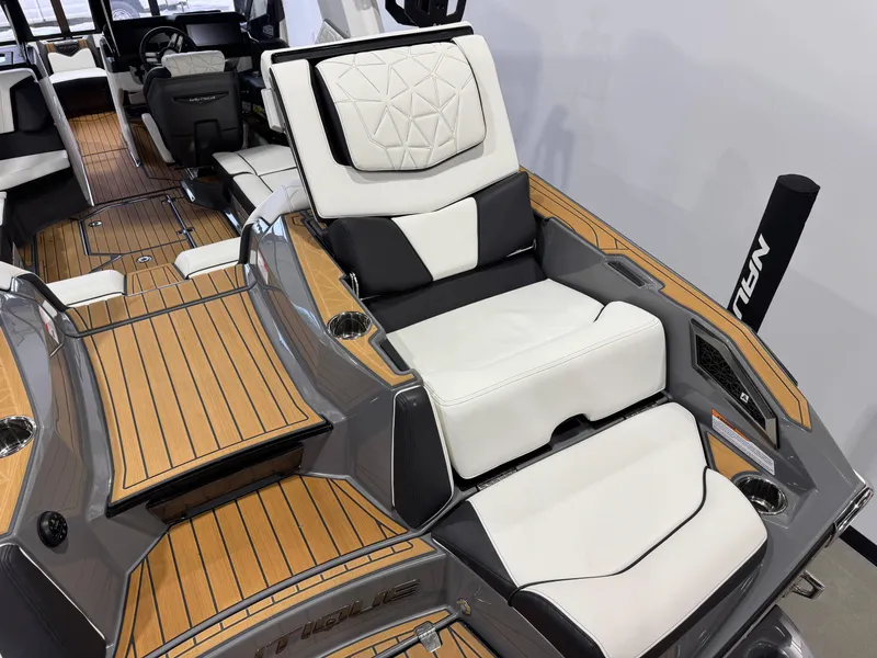 Slide: The Image of 2023 Nautique Super Air Nautique G23 Paragon interior with luxurious seating and teak flooring. - 14