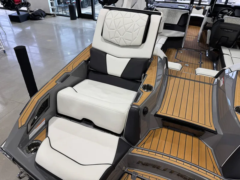 Slide: The Image of 2023 Nautique Super Air Nautique G23 Paragon interior with luxurious seating and teak flooring. - 15