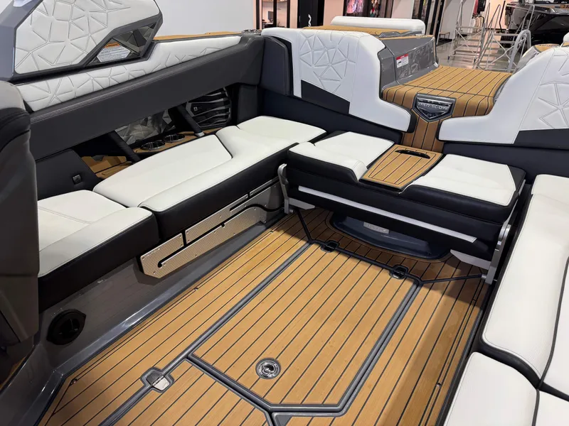Slide: The Image of 2023 Nautique Super Air Nautique G23 Paragon interior with luxurious seating and teak flooring. - 18