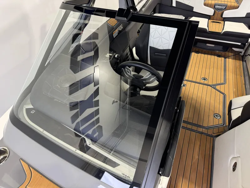 Slide: The Image of 2023 Nautique Super Air Nautique G23 Paragon interior with sleek design and wood flooring. - 23