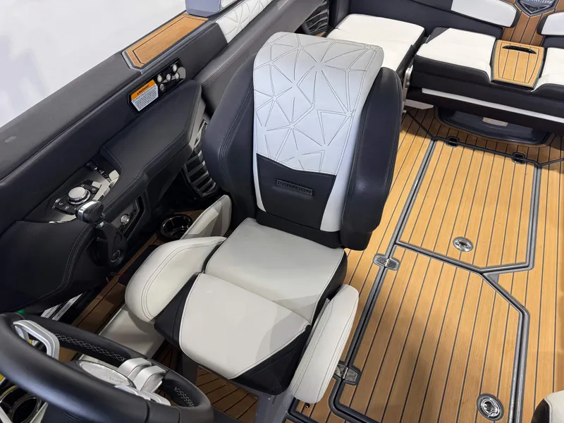 Slide: The Image of 2023 Nautique Super Air Nautique G23 Paragon interior with luxury seating and teak flooring. - 24