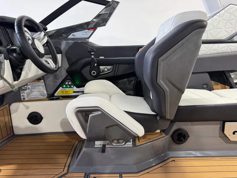 Slide: The Image of 2023 Nautique Super Air Nautique G23 Paragon interior with luxury seating and modern dashboard. - 26