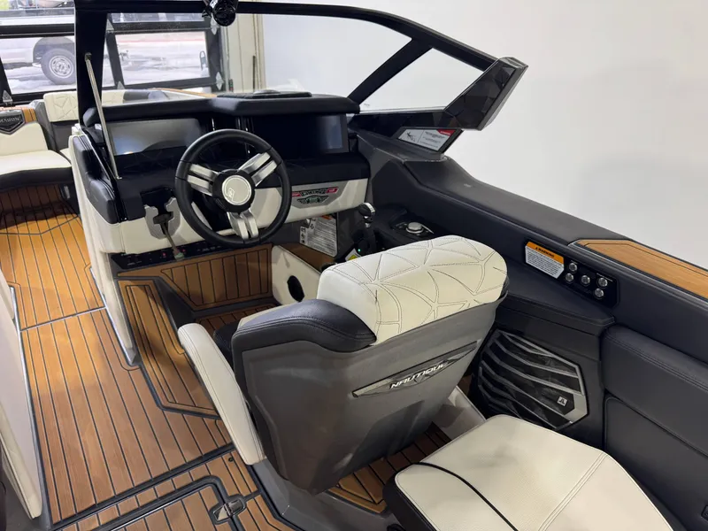 Slide: The Image of 2023 Nautique Super Air Nautique G23 Paragon interior with luxury seating and modern dashboard. - 27