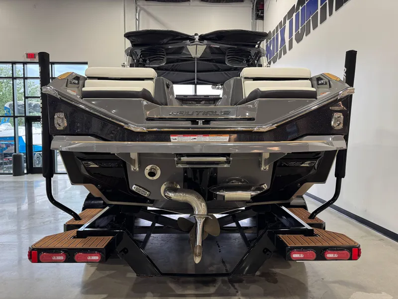 Slide: The Image of 2023 Nautique Super Air Nautique G23 Paragon boat, rear view in showroom. - 6