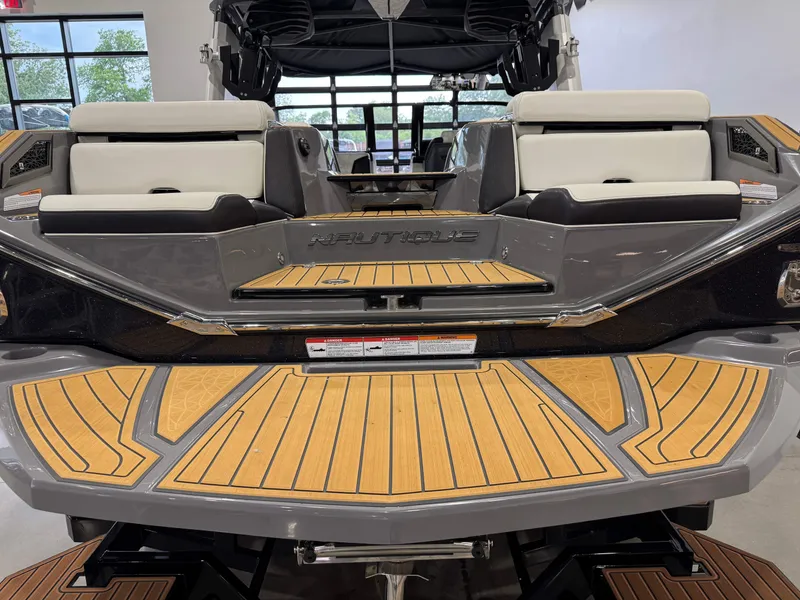 Slide: The Image of 2023 Nautique Super Air Nautique G23 Paragon boat with teak deck and white seating. - 8