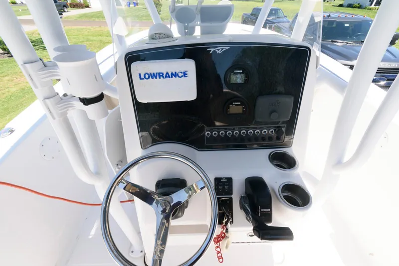 Slide: The Image of 2016 Tidewater 230 CC Adventure boat console with steering wheel and Lowrance electronics. - 10