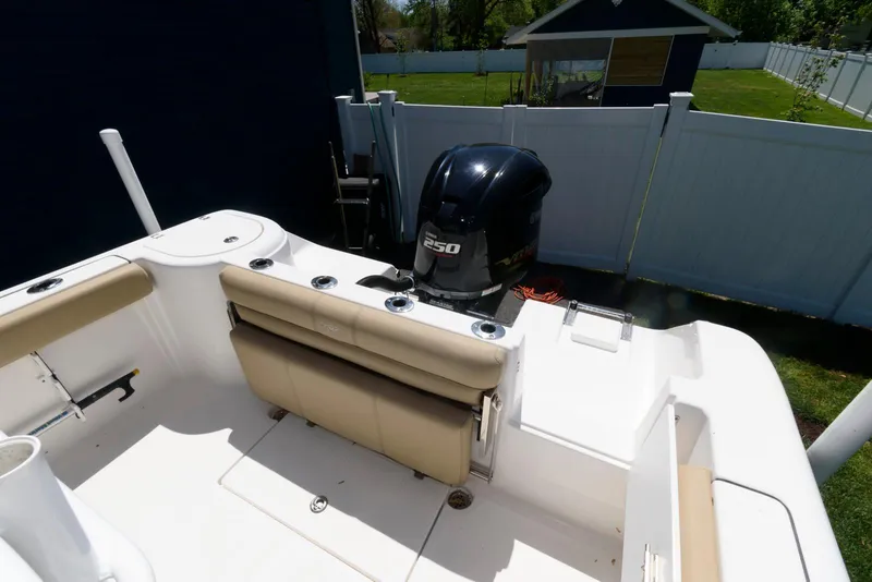 Slide: The Image of 2016 Tidewater 230 CC Adventure boat with Yamaha 250 engine, beige seating, and white deck. - 12