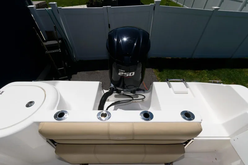 Slide: The Image of 2016 Tidewater 230 CC Adventure boat with Yamaha 250 engine, rear seating, and rod holders. - 13