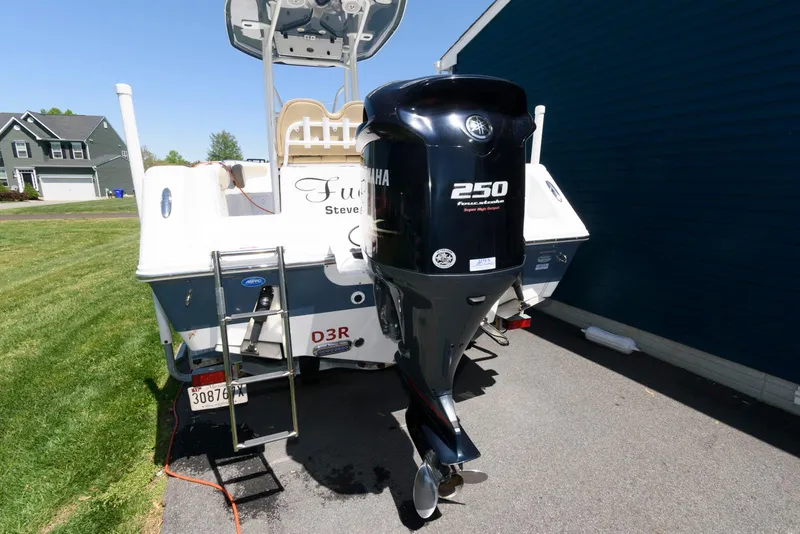 Slide: The Image of 2016 Tidewater 230 CC Adventure boat with Yamaha 250 outboard motor, parked on driveway. - 5