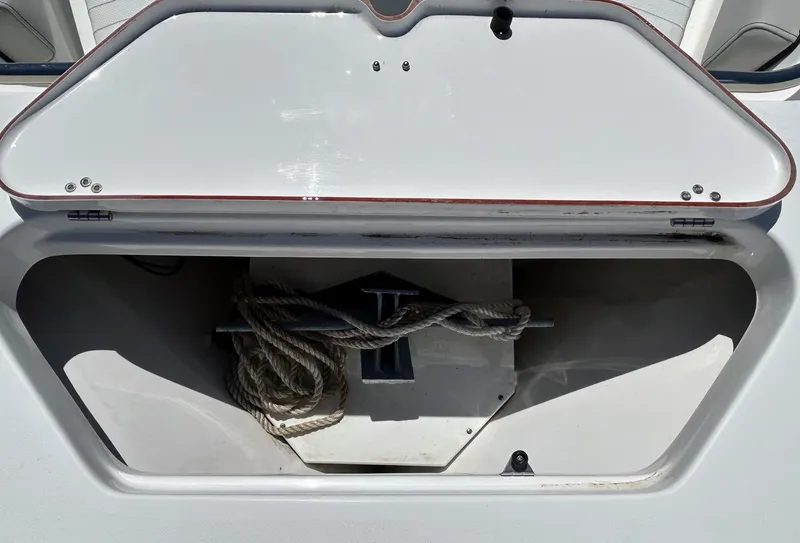 Slide: The Image of 2017 Sea Pro 219 Center Console anchor storage with rope inside. - 11