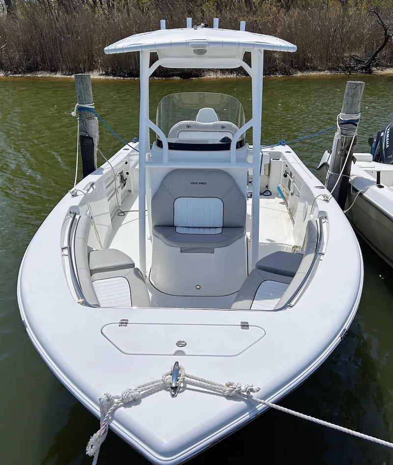 Slide: The Image of 2017 Sea Pro 219 Center Console boat docked in calm waters. - 3