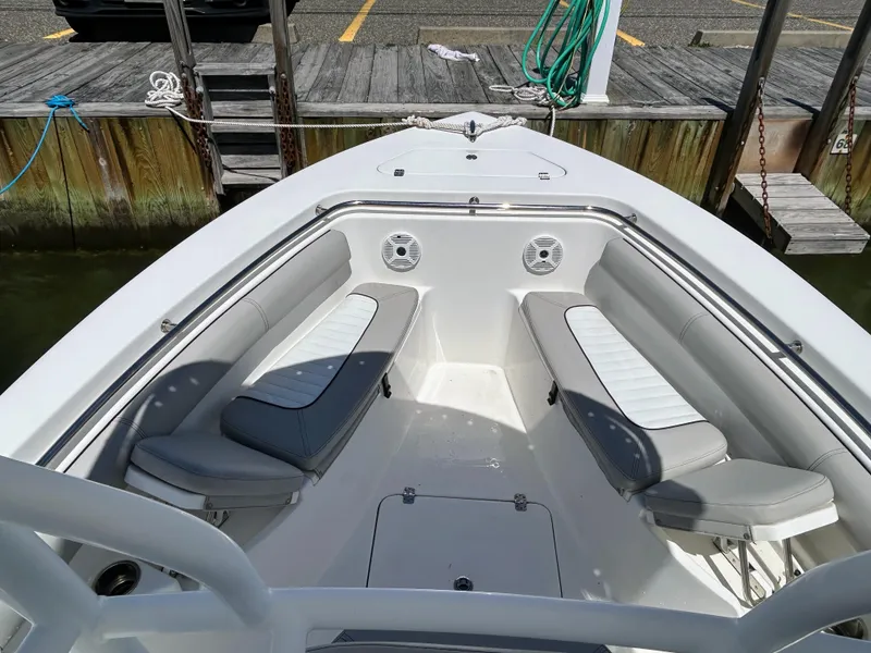Slide: The Image of 2017 Sea Pro 219 Center Console boat with spacious seating at the dock. - 6