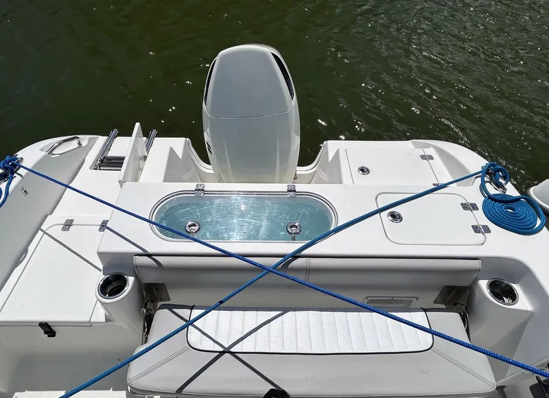 Slide: The Image of 2017 Sea Pro 219 Center Console boat with motor, blue ropes, and seating area. - 8