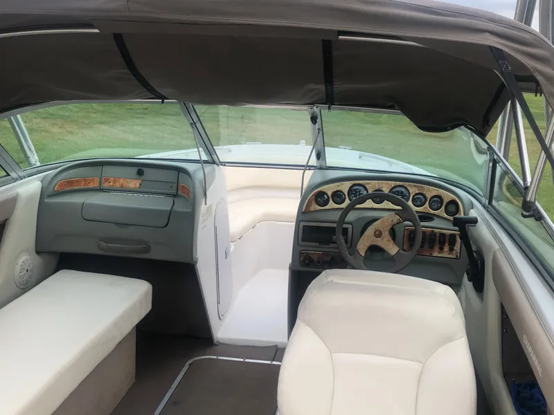 Slide: The Image of Interior of 1997 Chaparral 1930 SS boat with steering wheel and seating. - 5