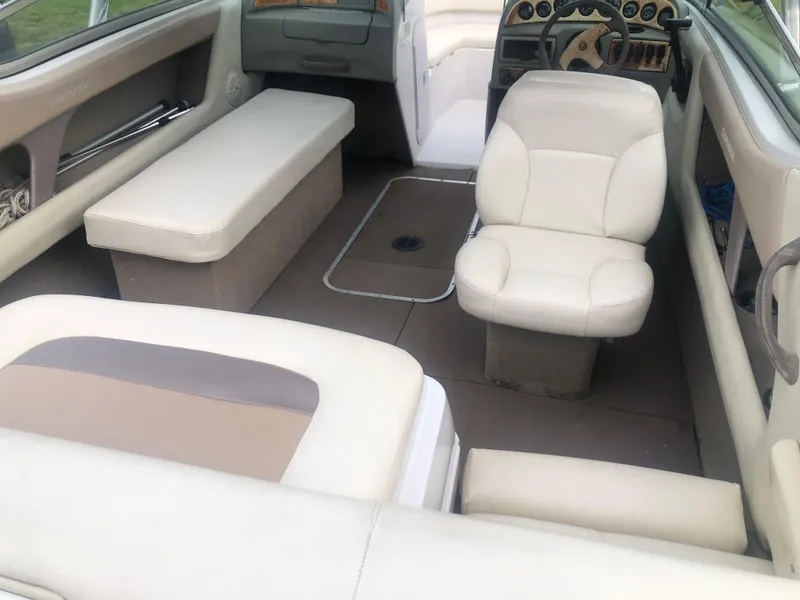 Slide: The Image of Interior of a 1997 Chaparral 1930 SS boat with beige seating and dashboard. - 6