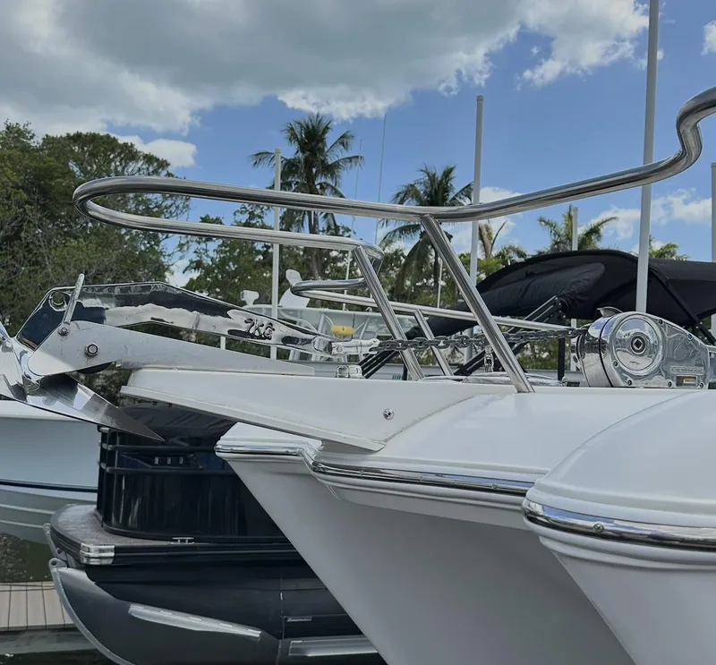 Slide: The Image of 2021 World Cat 255 DC boat docked, featuring sleek design and stainless steel railings. - 11
