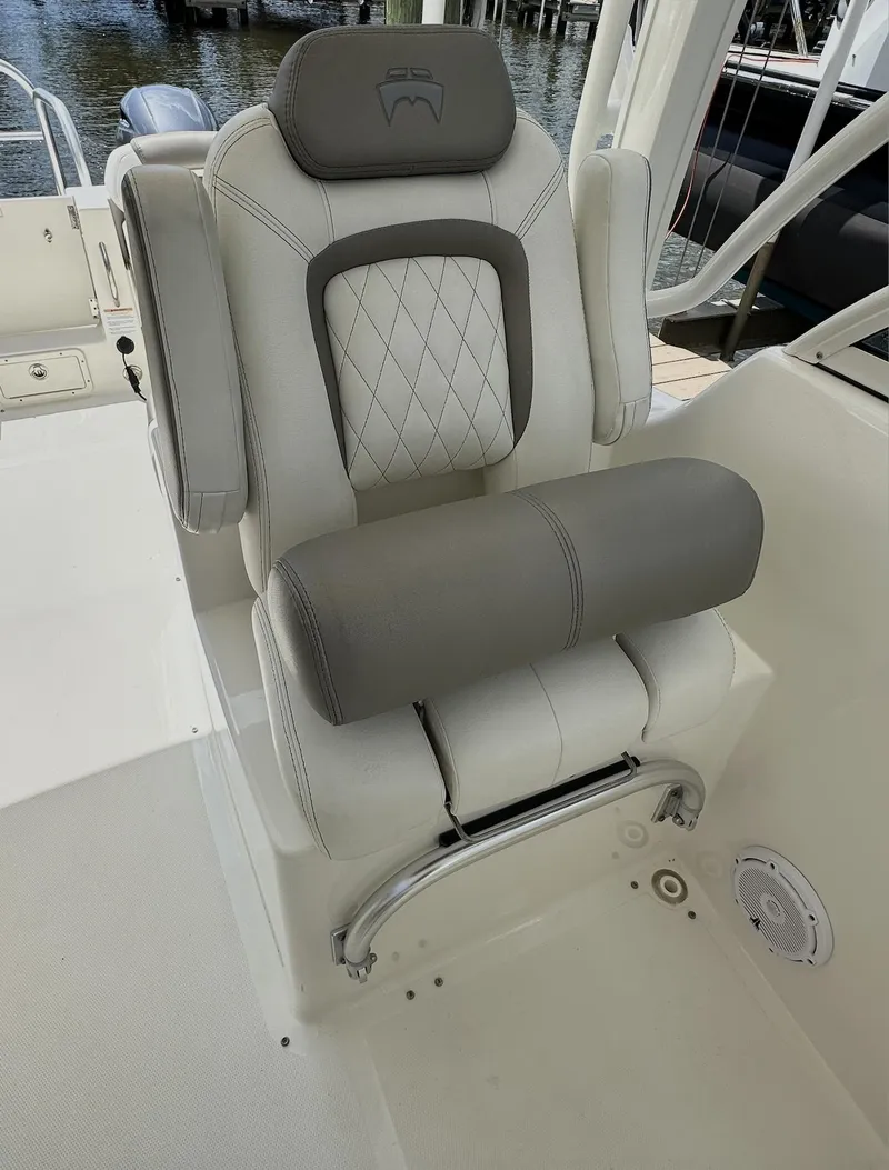 Slide: The Image of Luxury seating on 2021 World Cat 255 DC boat, featuring plush, diamond-stitched upholstery. - 24