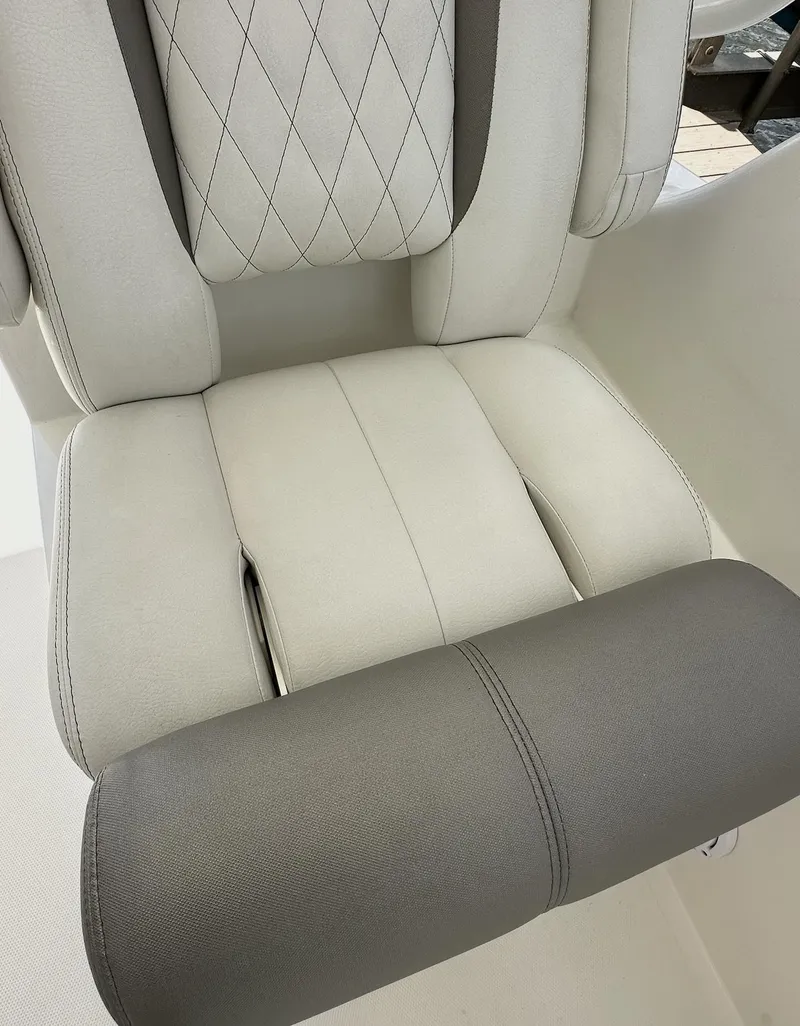 Slide: The Image of Luxury seating in 2021 World Cat 255 DC boat, featuring elegant stitching and premium materials. - 25