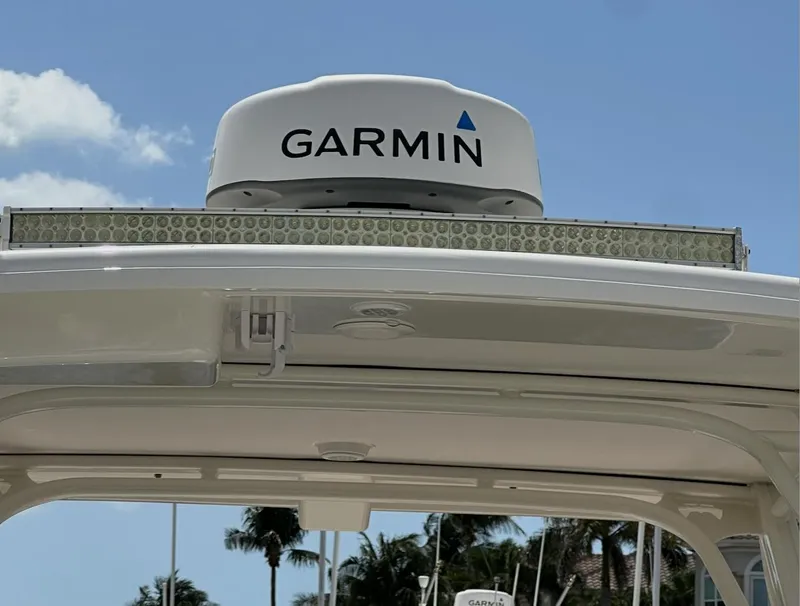 Slide: The Image of 2021 World Cat 255 DC boat with Garmin radar, clear sky background. - 27