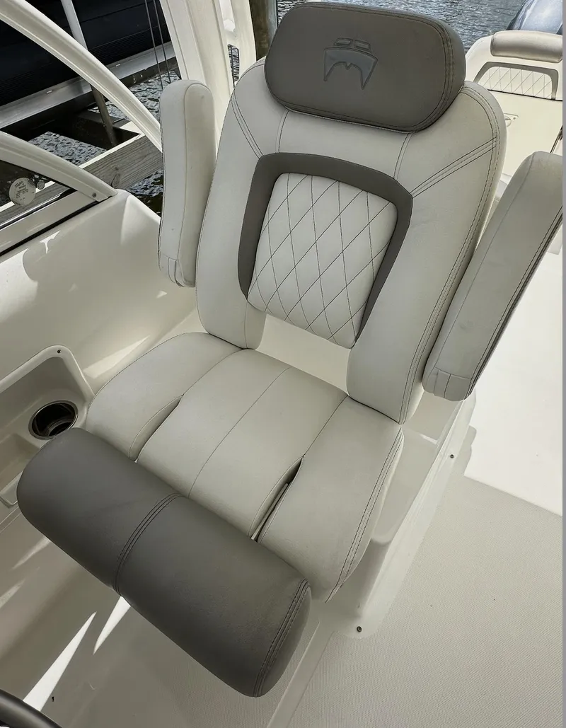 Slide: The Image of 2021 World Cat 255 DC boat seat with gray and white upholstery, featuring diamond stitching. - 28